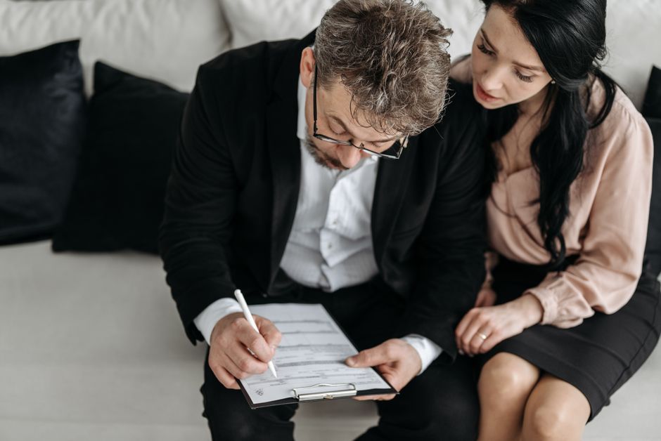 Landlord and tenant reviewing a lease agreement together