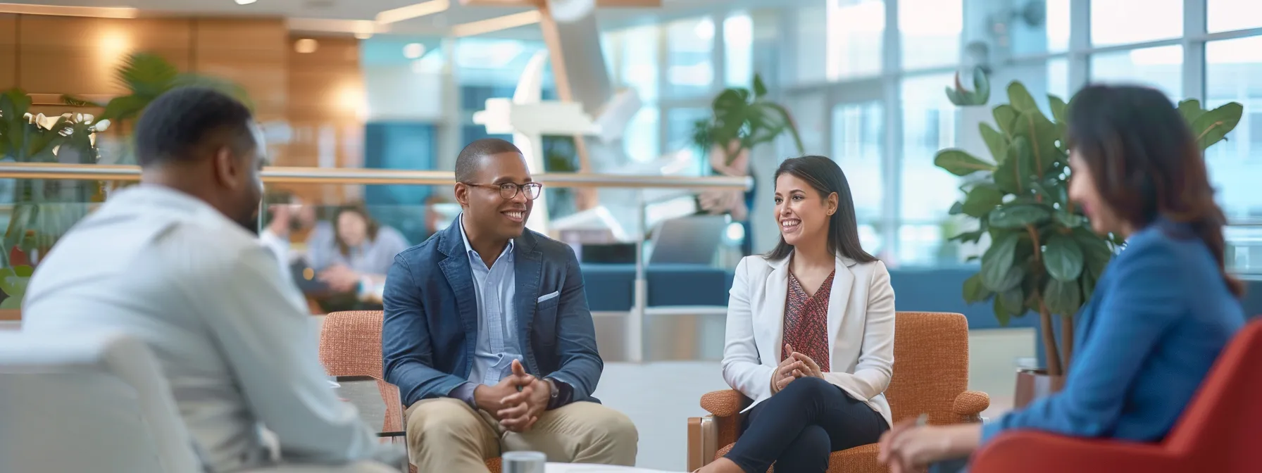 a diverse group of professionals in a modern office setting, discussing health insurance options with a large anchor symbol in the background.